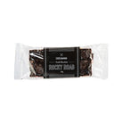 Dark chocolate rocky road bar in a clear wrapper with a black Chocamama label band