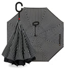 Reverse umbrella in Black & White Pinstripe, shown open and folded inward with its C-hook handle