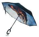 Bay Mare reverse umbrella held open on its side, with a black outer canopy and C-hook handle