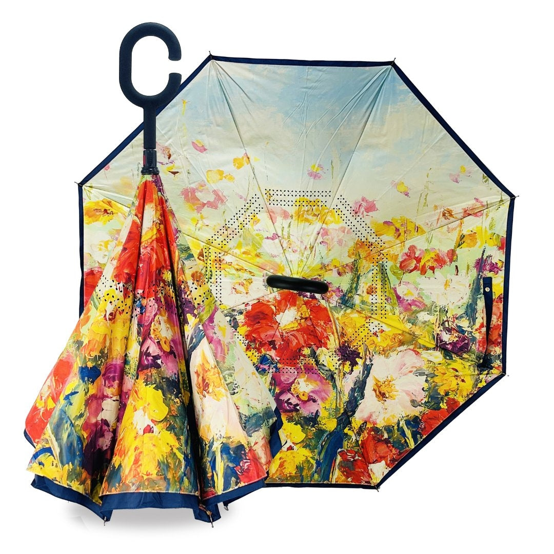 Reverse umbrella with an impressionist summer flower field painted inside, warm tones