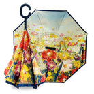 Reverse umbrella with an impressionist summer flower field painted inside, warm tones