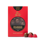 Chocamama milk chocolate raspberries box with two chocolates and a raspberry jelly in front