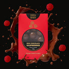 Milk chocolate raspberries box against a splash of chocolate with raspberries