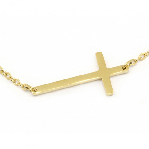 Fine gold chain bracelet with a slim cross lying sideways along the chain