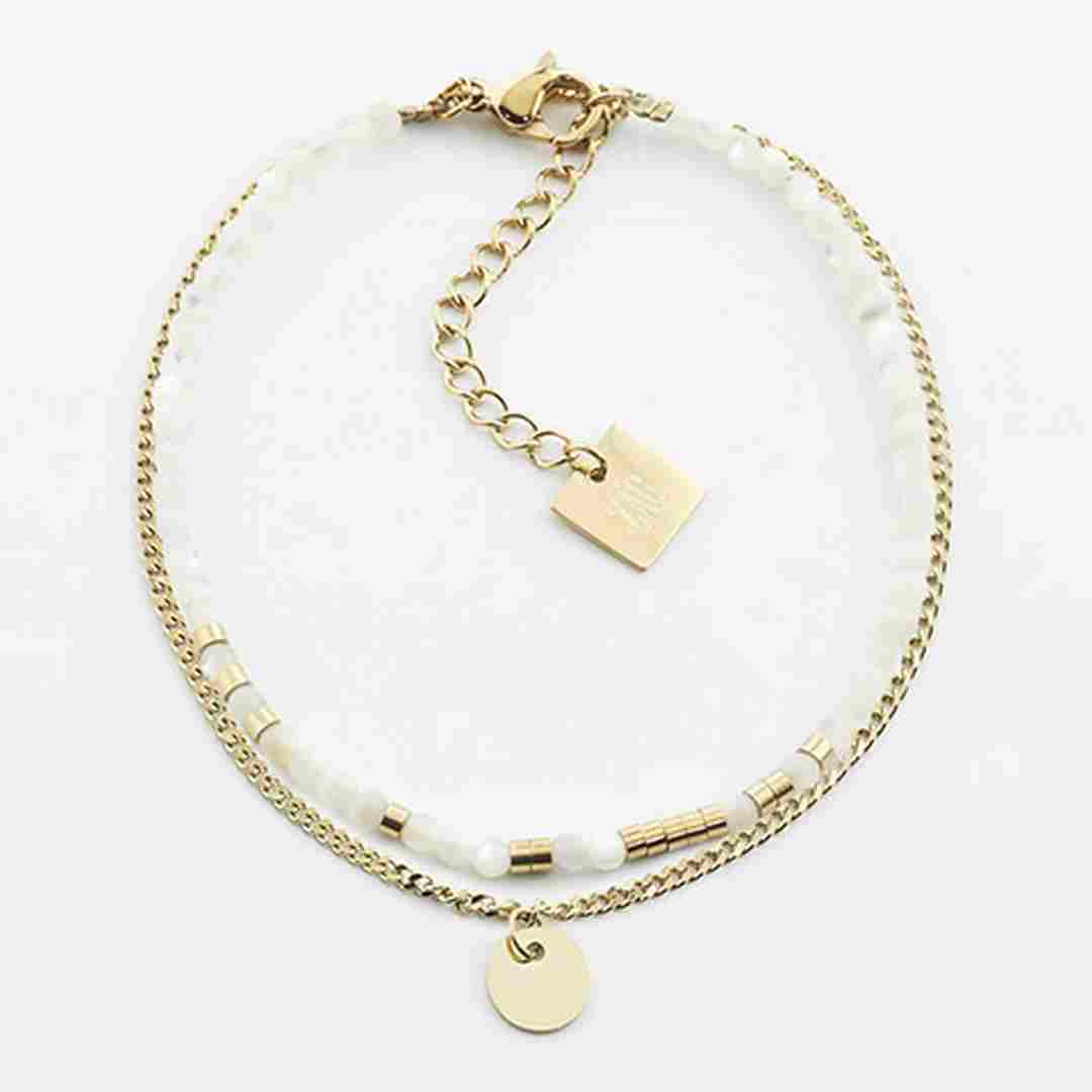 Double-row bracelet with a strand of pale mother-of-pearl beads beside a fine gold curb chain