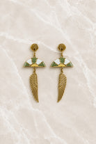Long gold stud earrings with a shell top, a white and sage green enamel fan, and a fluted gold wing drop