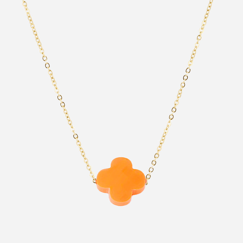 Fine gold chain necklace with an orange glass four-leaf clover pendant