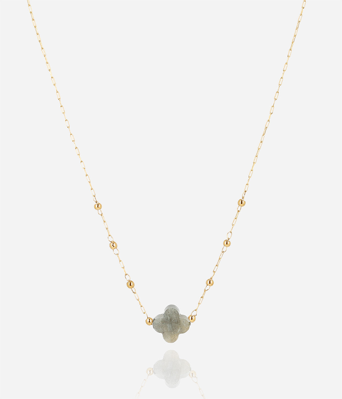 Velasquez necklace in labradorite: a grey labradorite clover pendant on a fine gold beaded chain, with a soft reflection below.