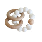 Beechwood teether with two natural wood rings threaded on white silicone beads