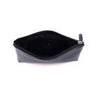 Navy makeup case unzipped, showing the dark lining and an inner slip pocket