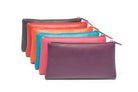 Flat leather makeup cases fanned out in black, red, orange, aqua, pink and purple