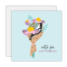 Square pale blue card with a magpie in a wrapped bouquet of pink and yellow flowers, lettered cutie pie Happy Birthday, on a white envelope