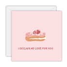 Square pale pink card with a strawberry-topped pink eclair and the words I declair my love for you, on a white envelope