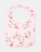 Toshi baby bib in pale pink cotton with a scattered floral print of coral, peach and blue blooms