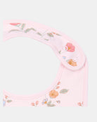 Close-up of the bib's adjustable press studs and neat pink bound edging