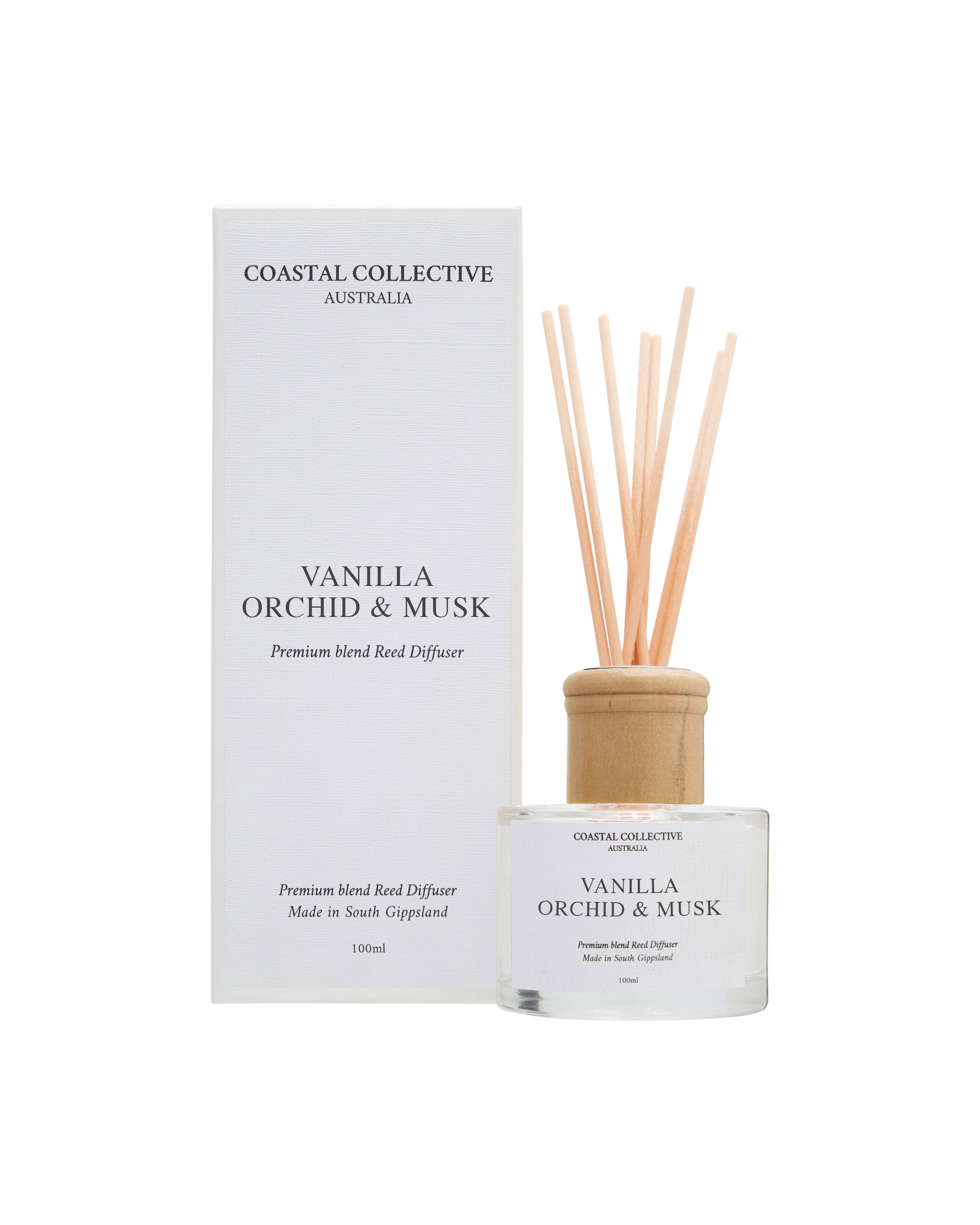 Vanilla Orchid & Musk reed diffuser, bottle and reeds in front of the matching box.