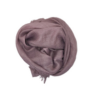 Beauty in Bamboo scarf in Vintage Rose, a dusty mauve-pink, rolled into a bun