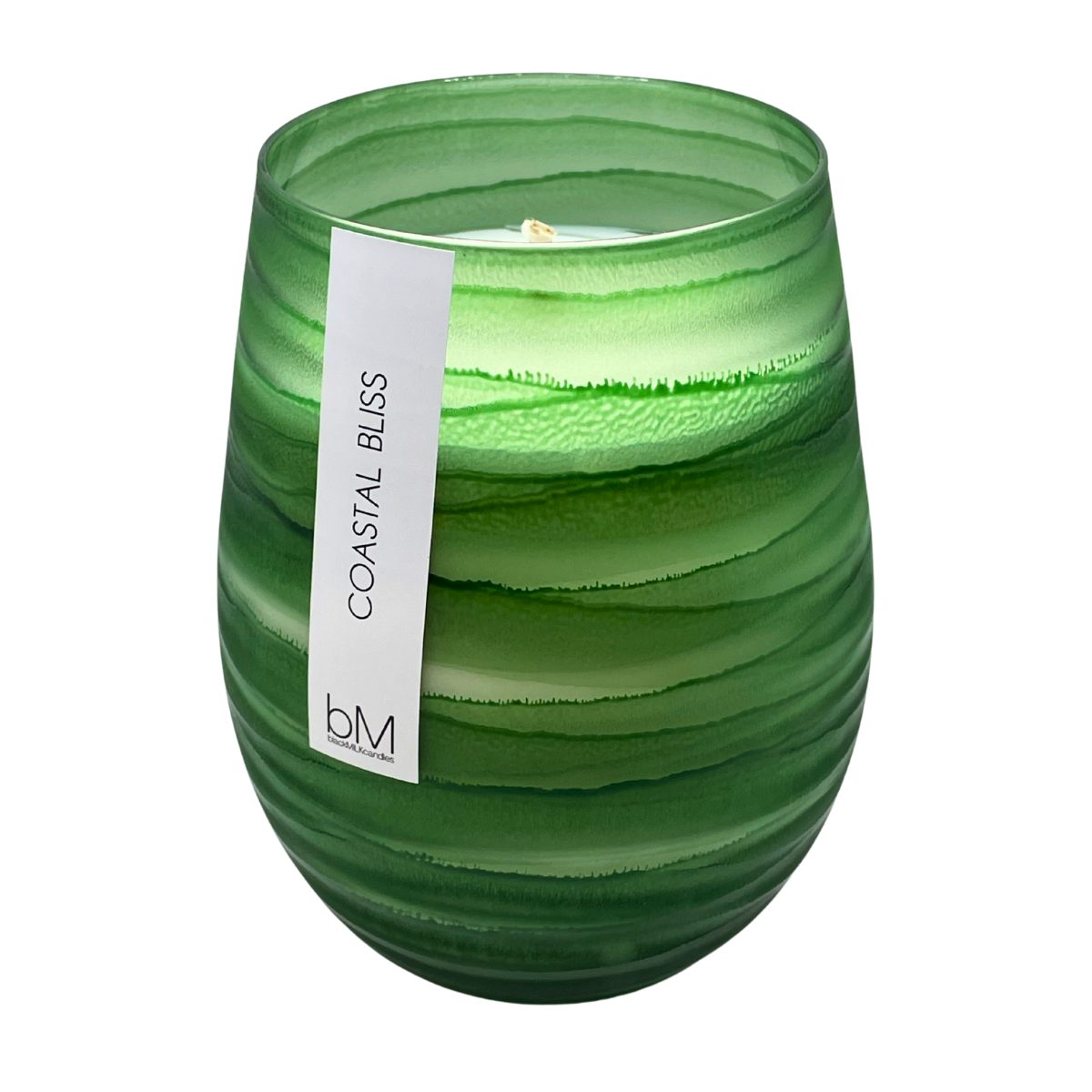 Wave Green Coastal Bliss soy candle in a rippled emerald glass vessel with a single wick