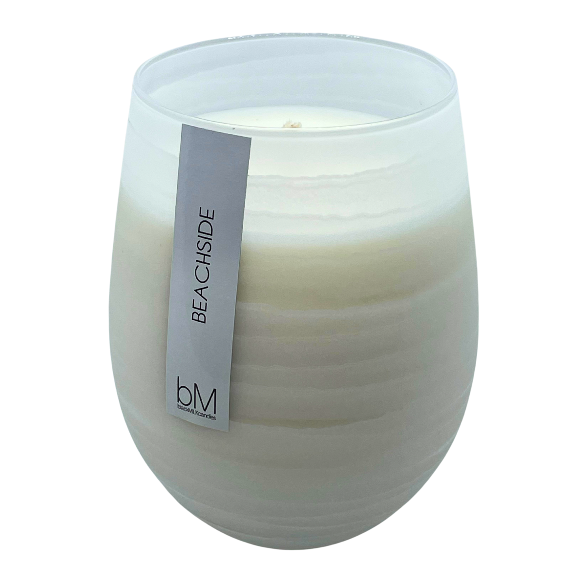 Wave White Beachside soy candle in a rippled pearl-white glass vessel with a single wick