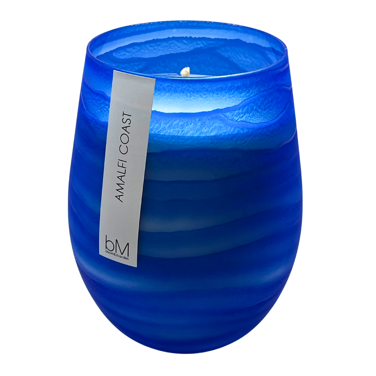 Wave Blue Amalfi Coast soy candle in a rippled cobalt-blue glass vessel with a single wick