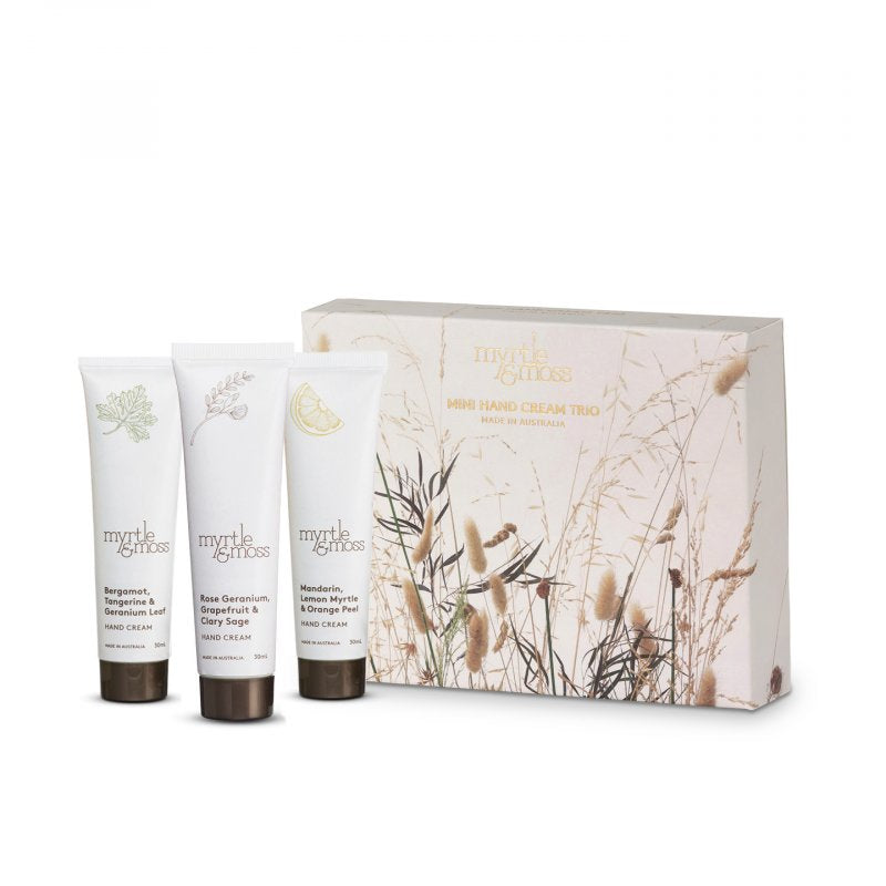 Myrtle & Moss Mini Hand Cream Trio box printed with dried grasses, beside three 30 mL tubes: Bergamot, Rose Geranium and Citrus.
