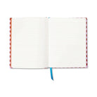 The Fish journal open at its lined pages, a blue ribbon marker hanging below.