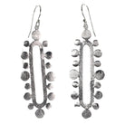Silver wash statement drop earrings — an open oval framed by brushed silver discs