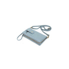 The pale blue wallet lying at an angle with the long strap looped behind.