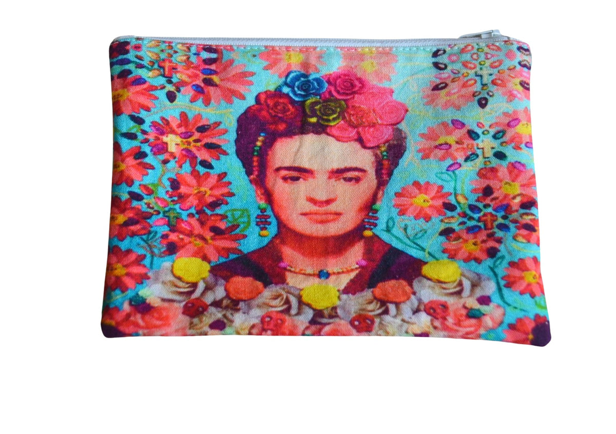 Zip-top pouch printed with Frida Kahlo, roses in her hair, among coral daisies on turquoise, with a white zip along the top