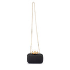 The black clutch hanging from its long gold chain