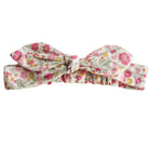 Knotted cotton head bow in a cream fabric with pink and yellow flowers