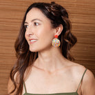 Alice earrings in red worn by a model
