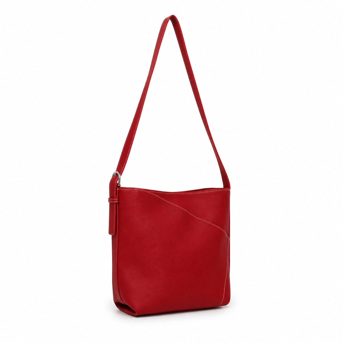The red shoulder bag turned slightly, showing the curved seam and strap buckle.
