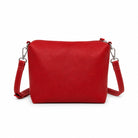 The red mini cross body bag on its own, with a zip top and a clip-on strap.