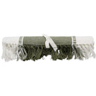 Olive table runner rolled and tied with a cream ribbon