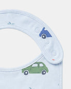 Close-up of the bib's adjustable press studs and printed cars