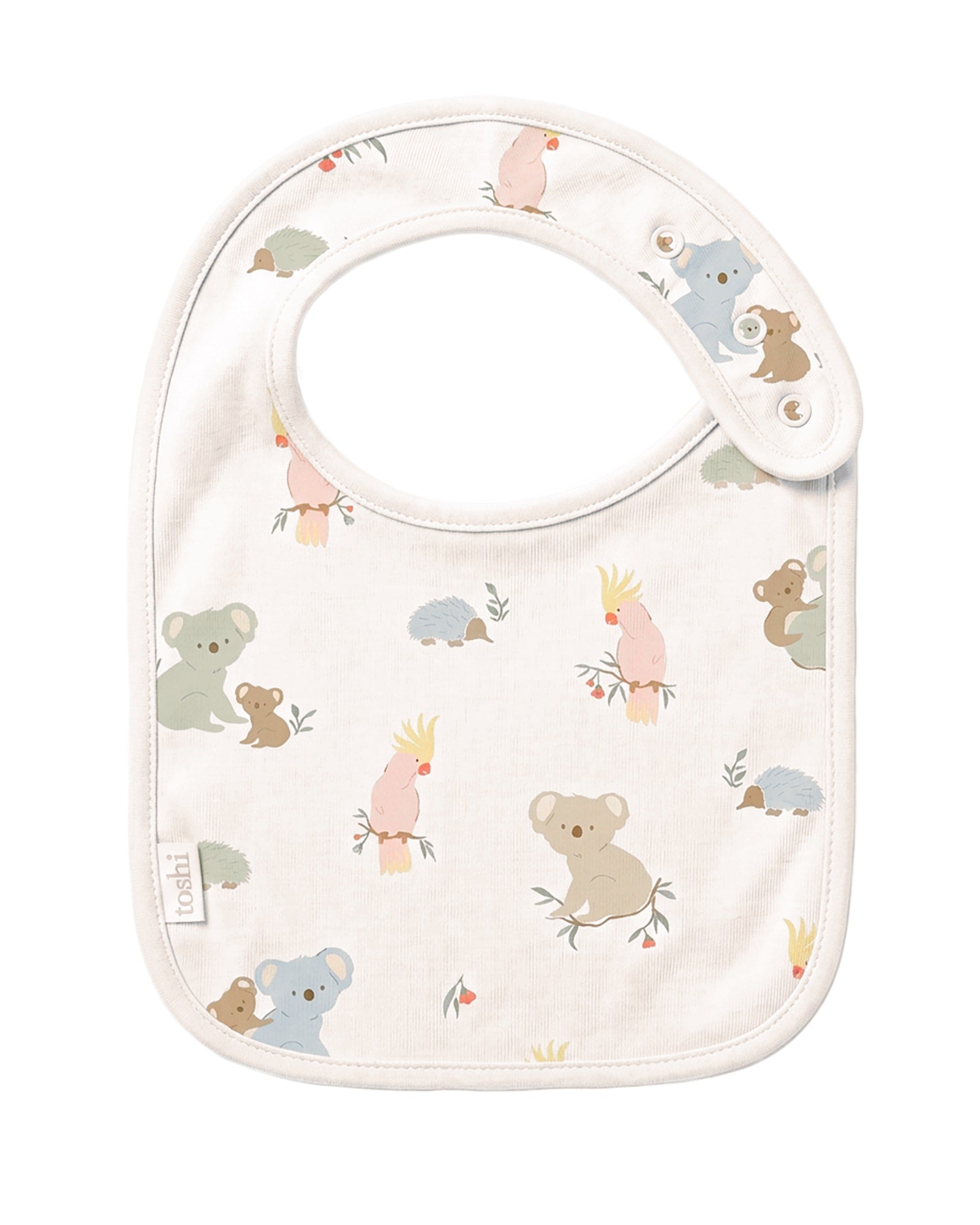 Toshi Arcadia Gumnut Babies baby bib in cream cotton printed with koalas, cockatoos and echidnas