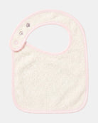 Back of the Wild Garden bib showing its cream cotton towelling lining and press studs