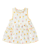 Toshi Pippa sleeveless baby dress in vanilla cotton with a small yellow, orange and pink blossom print, yellow trim and two pockets