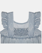 Close-up of the smocked back panel and frilled cap sleeves