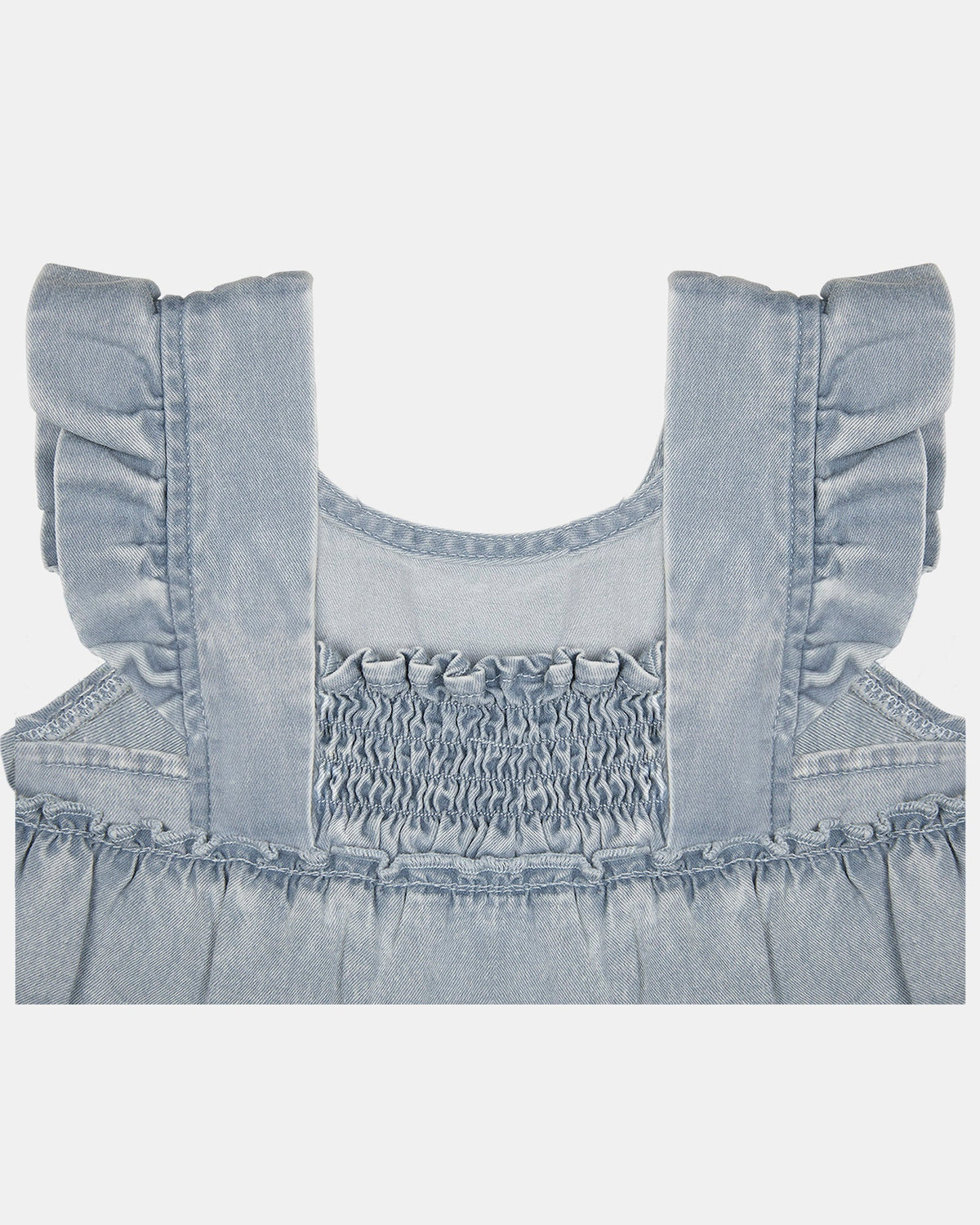 Close-up of the smocked back panel and frilled cap sleeves
