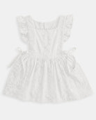 Toshi Florence pinafore in white embroidered cotton with frilled straps and bow ties at the sides