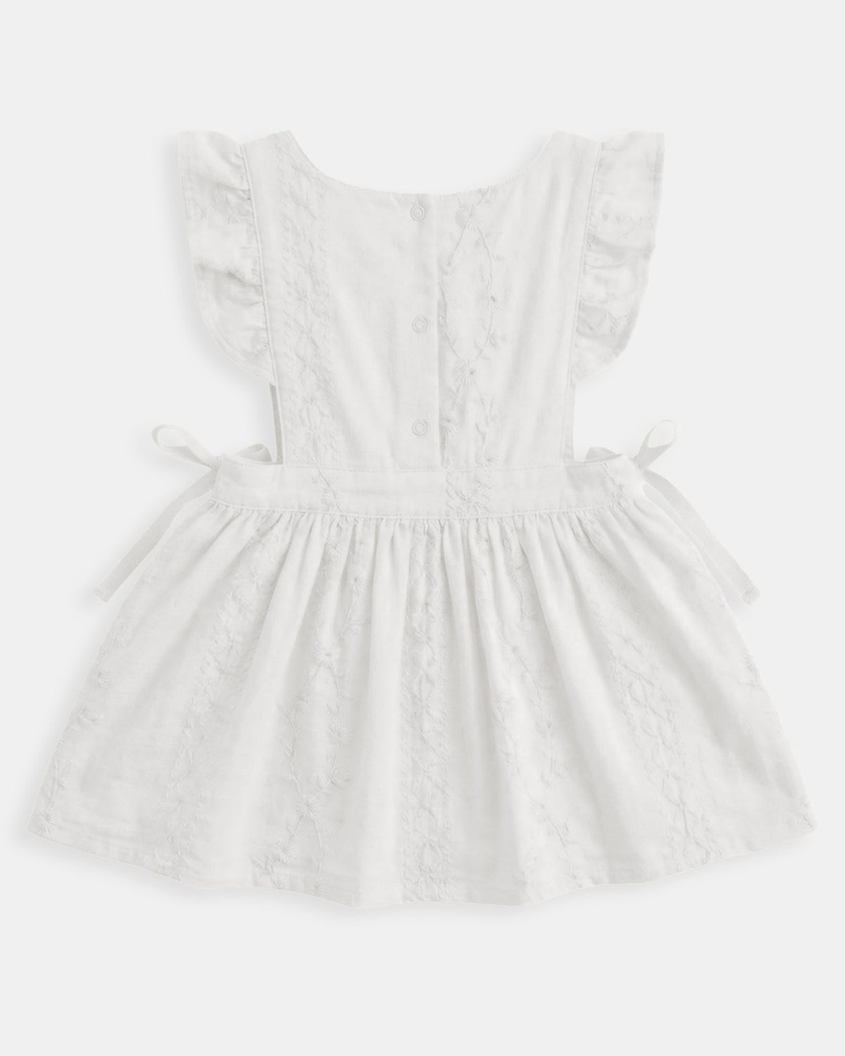 Back of the Florence pinafore showing the frilled straps and side ties