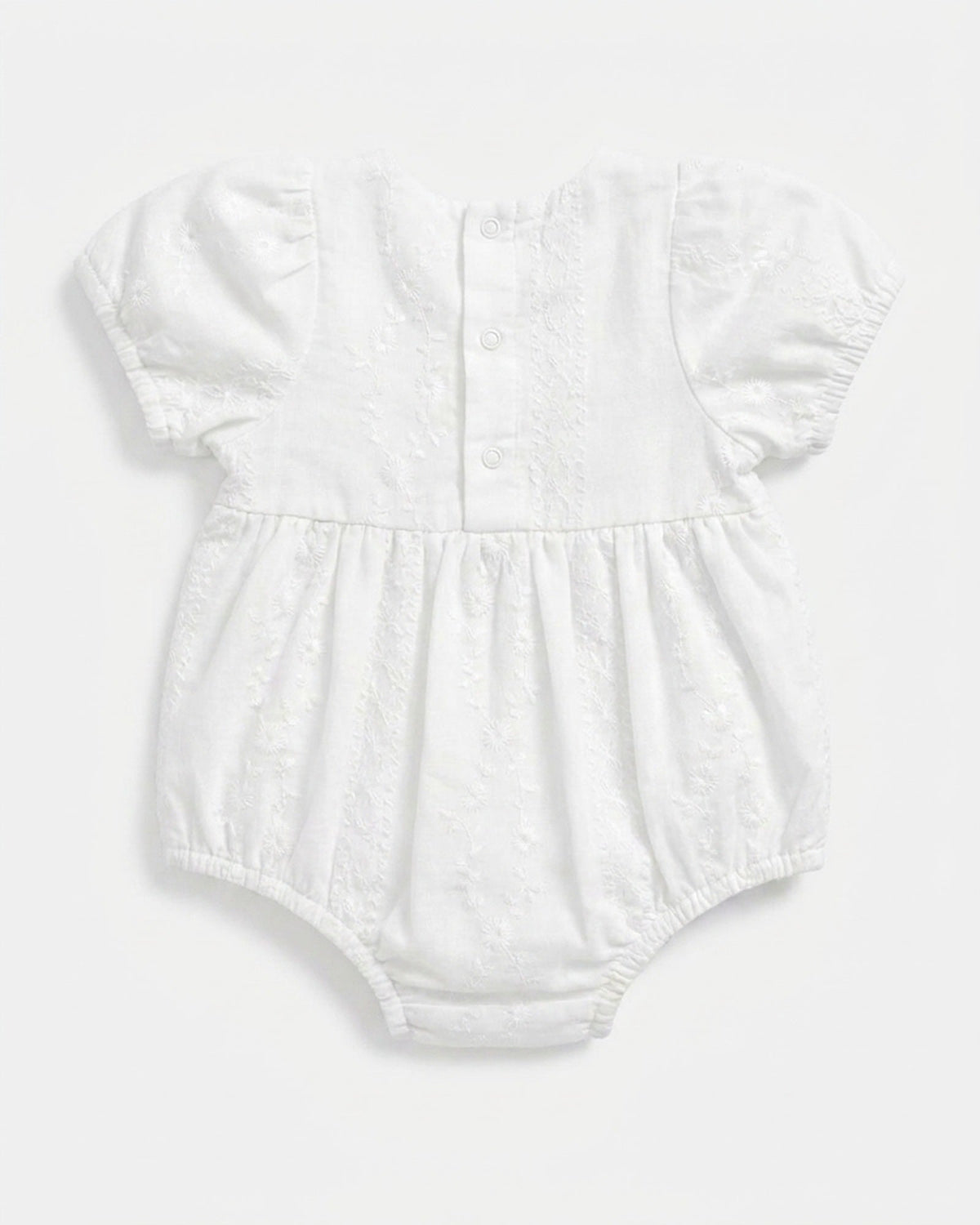 Back of the Florence romper with its press-stud placket at the neck