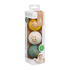 The three musical balls stacked in their printed retail carton with a clear window.