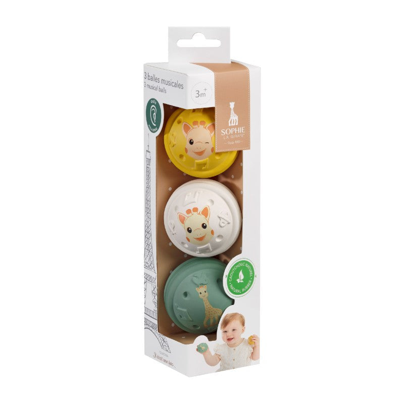 The three musical balls stacked in their printed retail carton with a clear window.