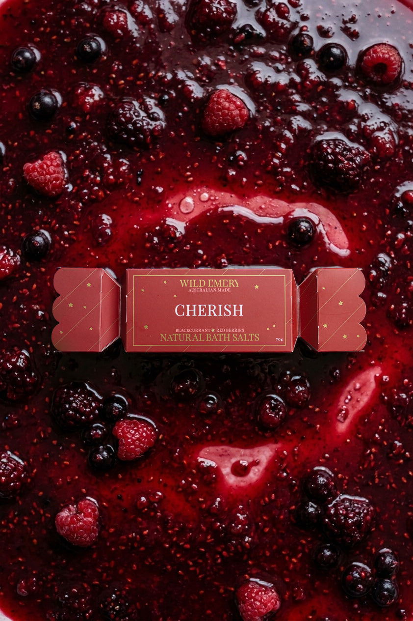 The Cherish bon bon on a bed of mixed berries in red jam.