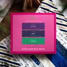 Pink Cool and Clear gift box printed with three bath salt bon bons: Escape, Enjoy and Exhale.