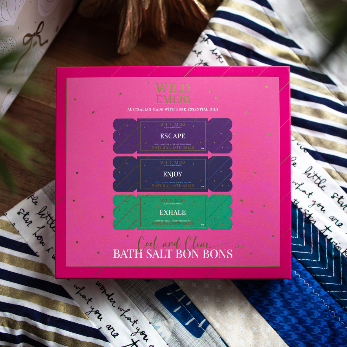 Pink Cool and Clear gift box printed with three bath salt bon bons: Escape, Enjoy and Exhale.
