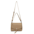 The biscuit bag with both straps attached, the shoulder strap and the longer cross body strap.